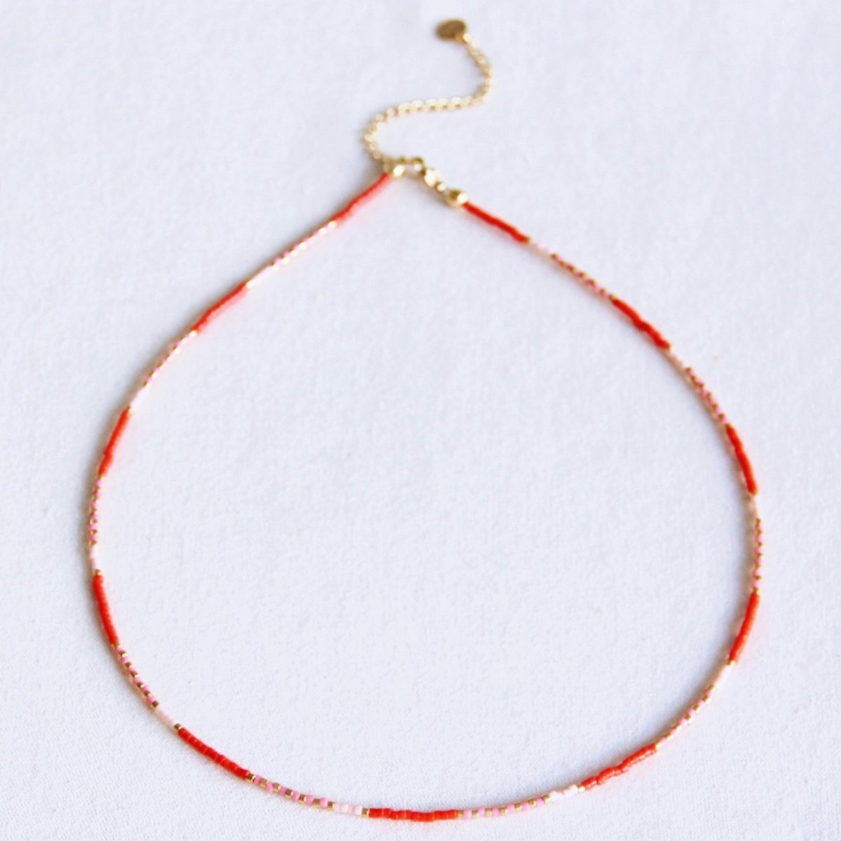 Kralen ketting rood/roze/nude