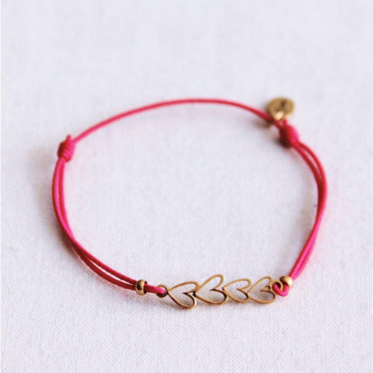 Elastische armband met hartjes - Fuchsia