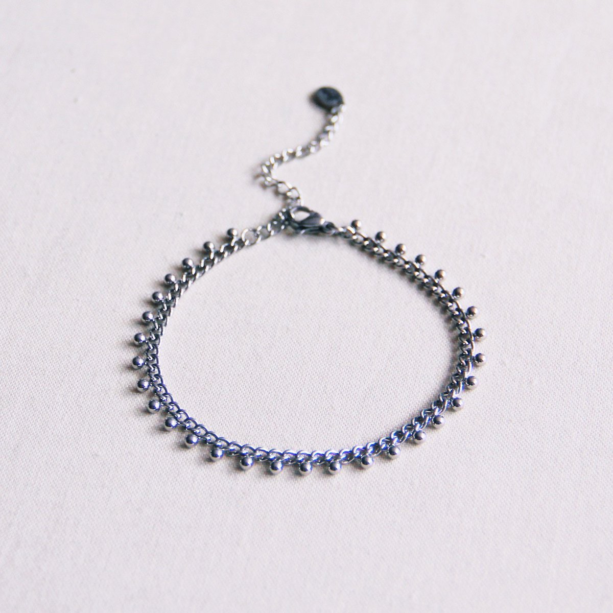 Schakelarmband met balletjes - zilver