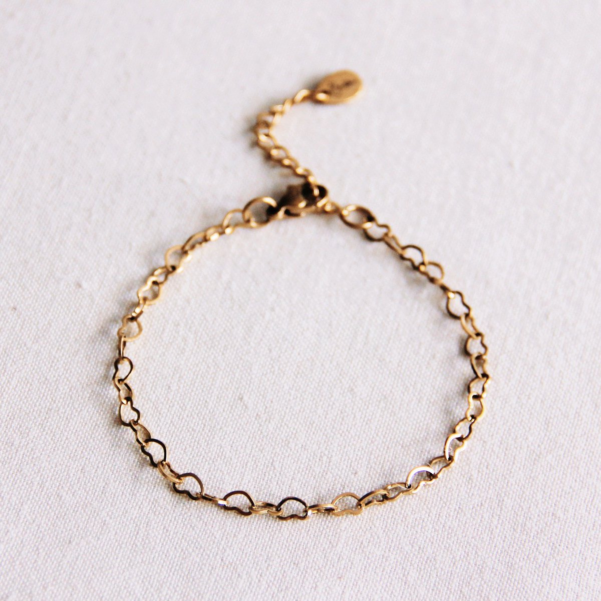 Armband schakel hartjes - goud