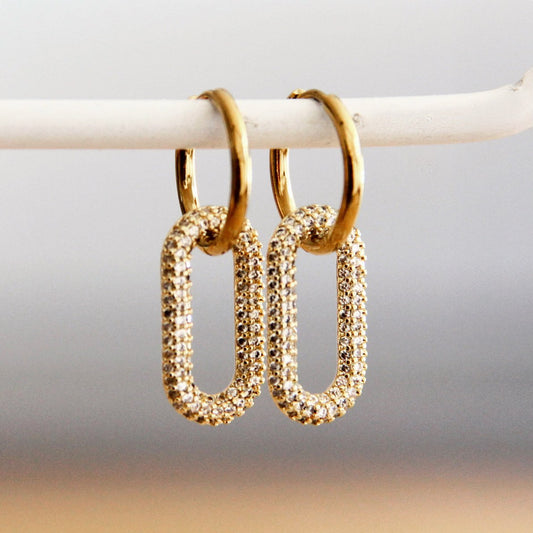 Earring with oval crystal pendant