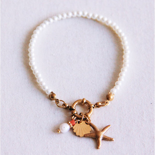 Pearl bracelet with charms