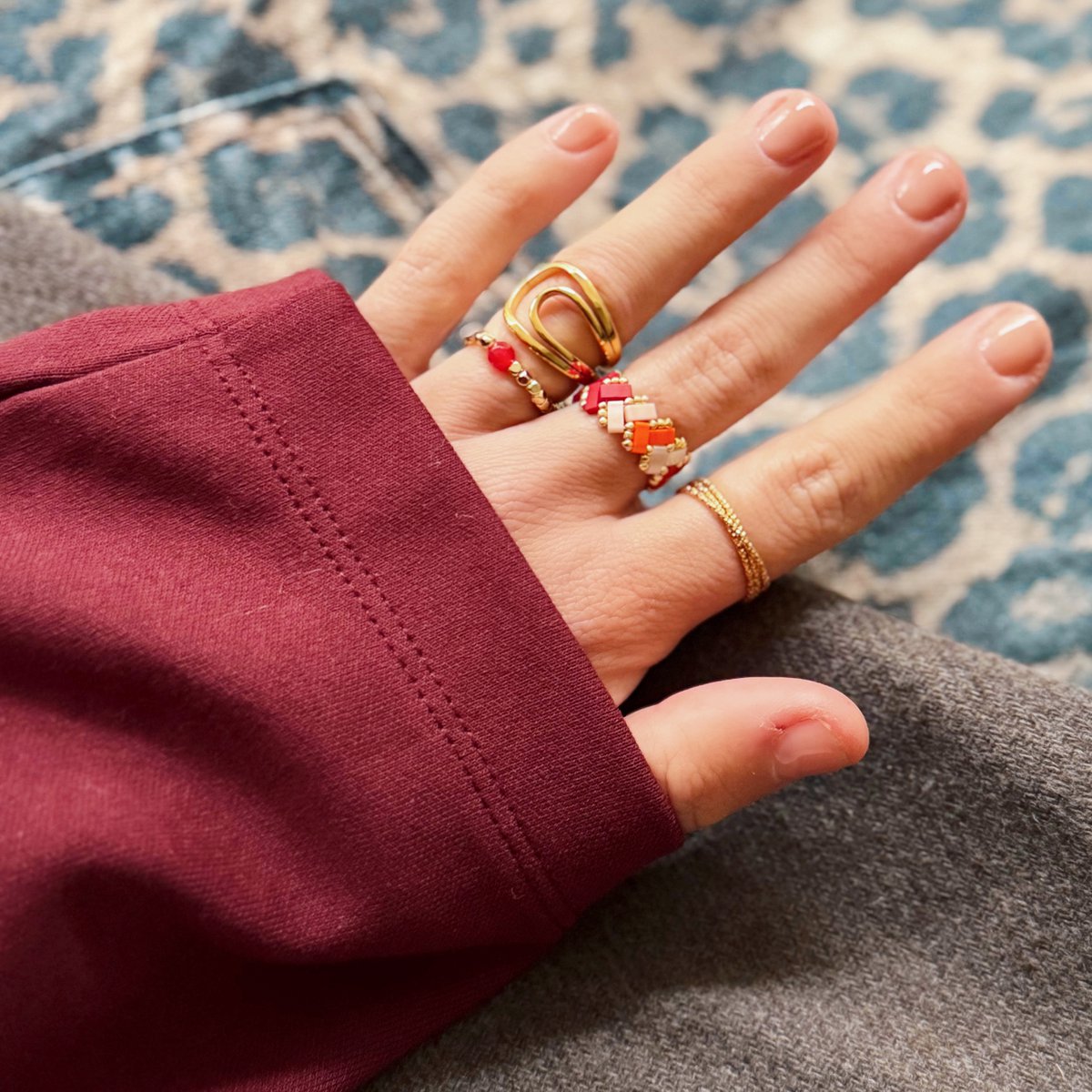 Elastische ring met steen - oranje/goud